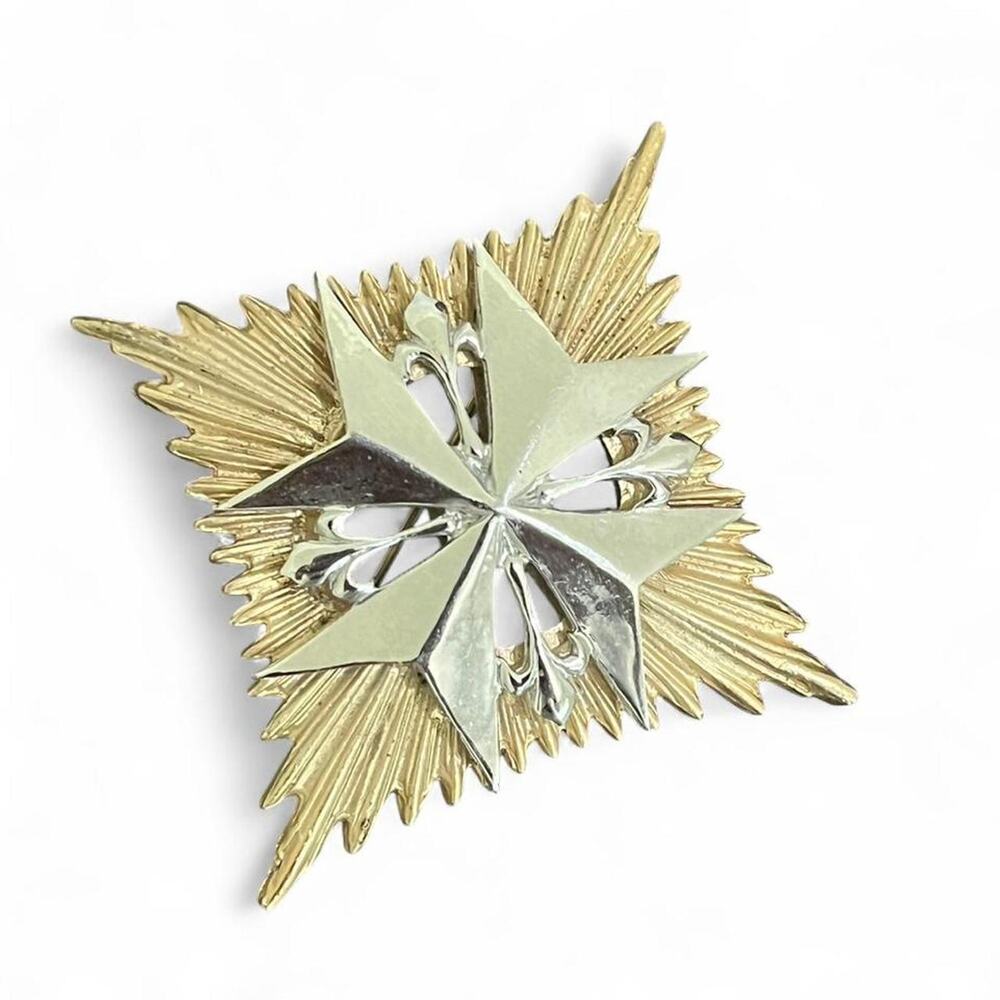 Silver and gold maltese cross